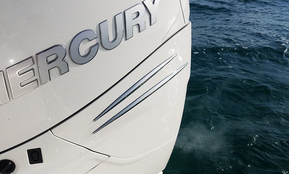 Mercury outboard blowing white smoke